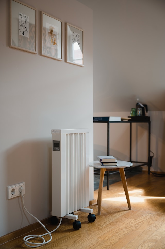 electric heater next to a living room wall